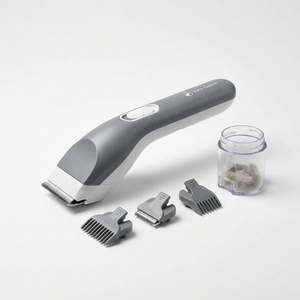 7-in-1 pet grooming kit with built-in hair vacuum, attachments and dust tank